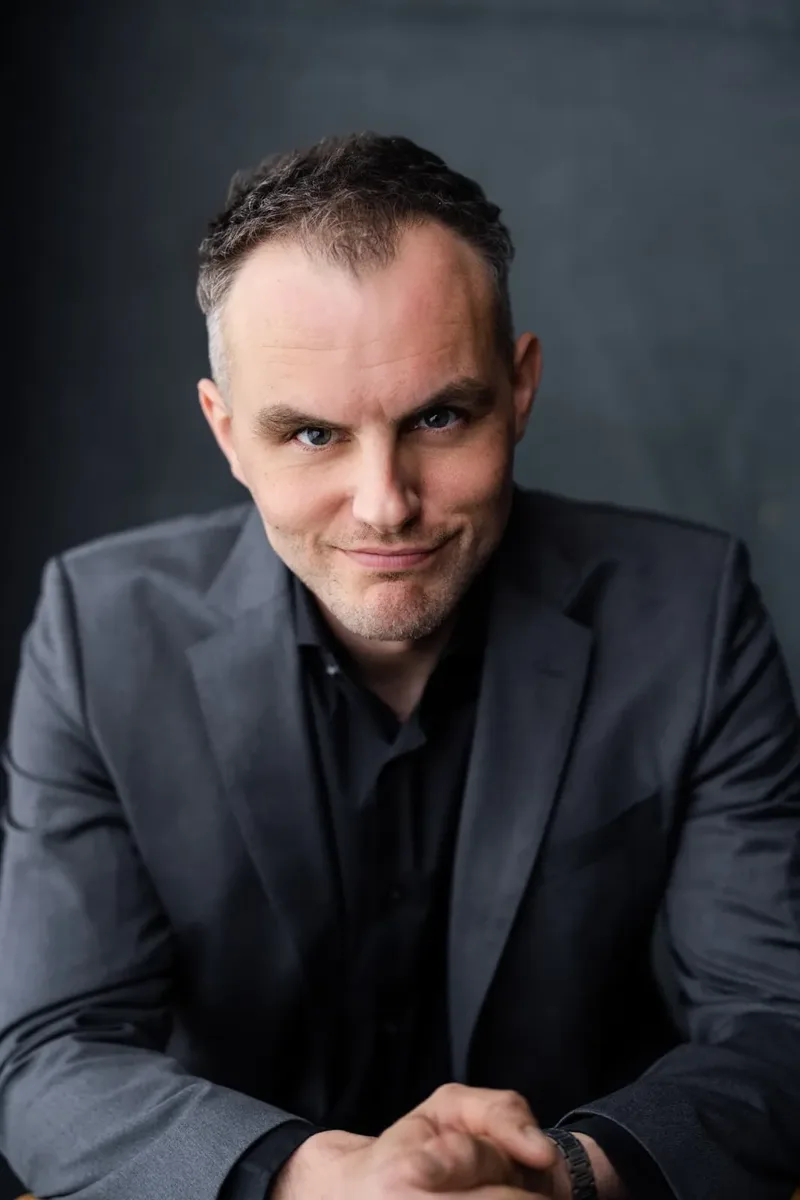 A headshot of Danny