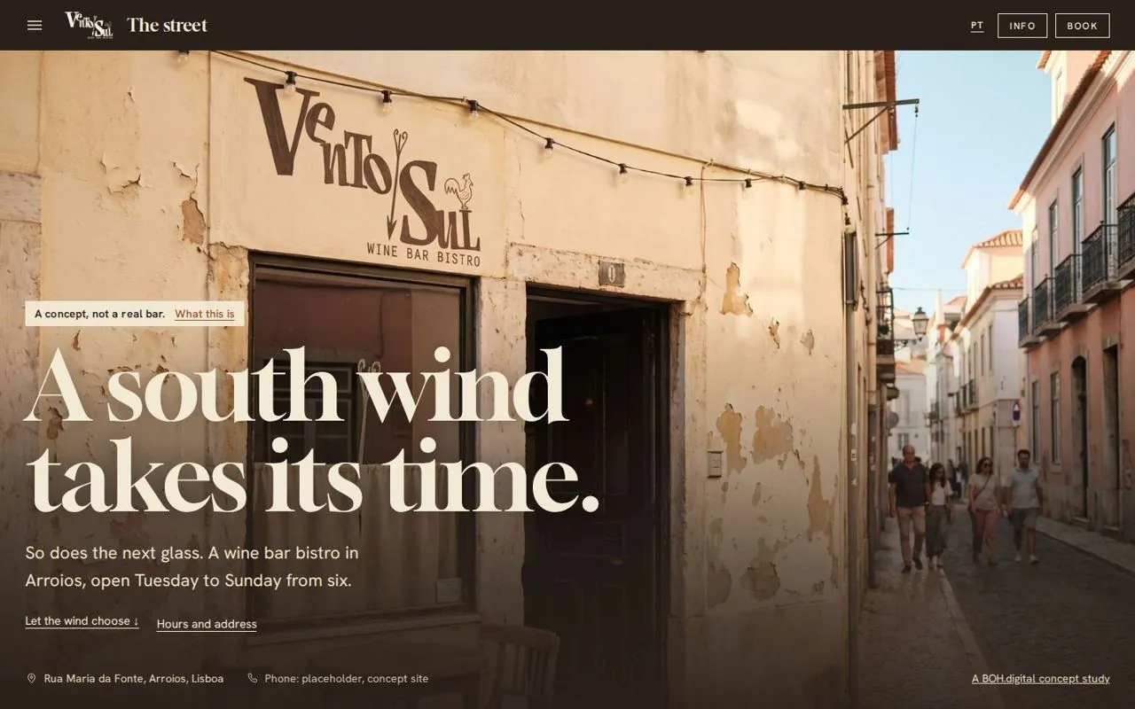 The street: the painted shopfront with the statement 'A south wind takes its time.'